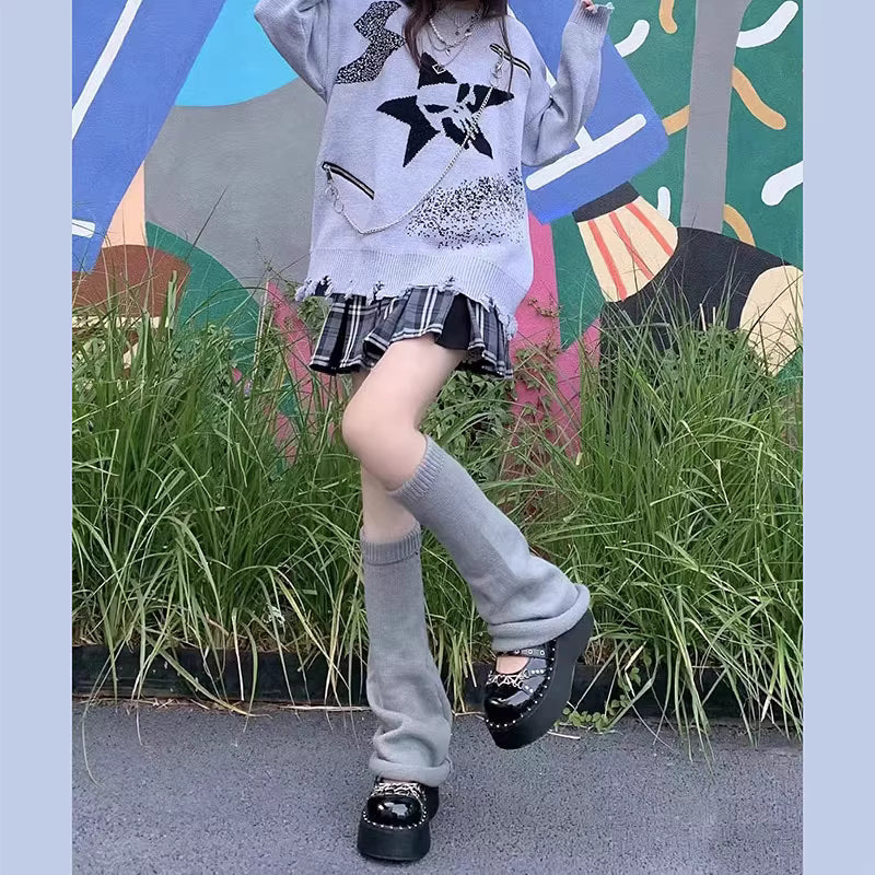 Inspired by the bold fusion of Y2K aesthetics and Japanese street style, these flared leg warmers redefine cozy fashion. The bell-shaped design and soft knit fabric combine retro glamour with Lolita sweetness, while the stacked mid-calf fit offers both warmth and a striking silhouette. Perfect for adding a playful yet edgy statement to any outfit, blending millennial nostalgia with contemporary cuteness.