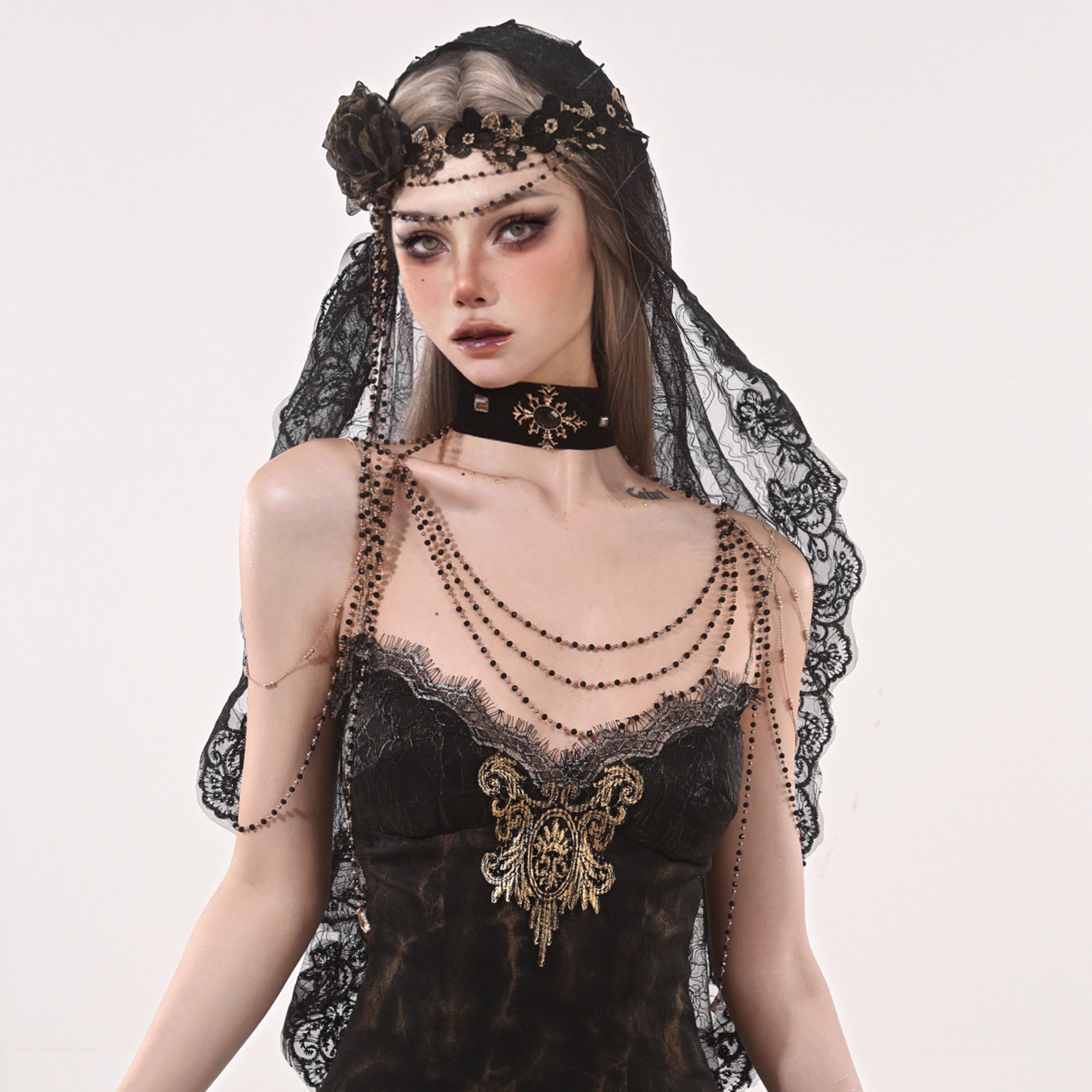 Design Concept:
This Gothic Lolita headpiece captures the essence of dark elegance with its mysterious black lace veil and delicate fabric flower detailing. Inspired by Gothic aesthetics and infused with a unique "Broken Bone" motif, the design creates a striking visual effect that perfectly complements Lolita, cosplay, or themed outfits. Crafted with adjustable details for a comfortable fit, it serves as a versatile accessory for photoshoots, stage performances, or special events.