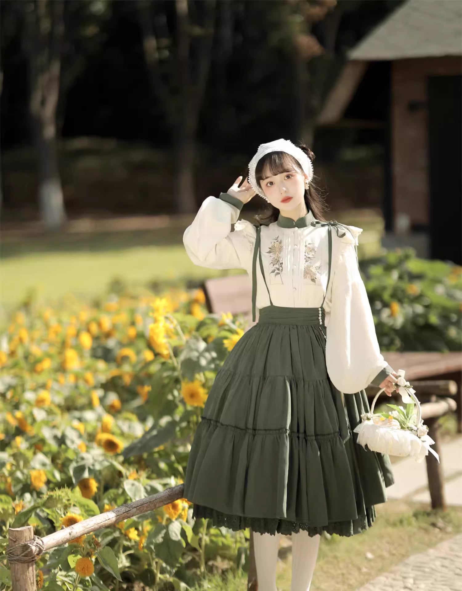 This Green Sunflower Embroidery Lolita Set blends the elegance of Hanfu-inspired details with the sweetness of classic Lolita fashion. The delicate sunflower embroidery brings a fresh pastoral charm, while the layered JSK and long-sleeve blouse create a refined silhouette. Designed for comfort and beauty, it is perfect for spring and autumn wear. Whether for tea parties, garden walks, or seasonal gatherings, this set captures a graceful harmony of tradition and modern Lolita style.