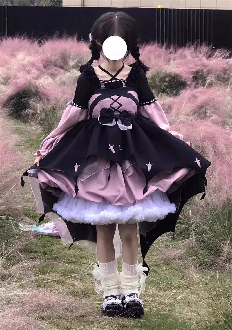 This Black Pink Cute Lolita JSK Dress blends sweet Lolita charm with a playful little witch aesthetic. Designed as a suspender-style JSK, it features a flattering silhouette suitable for autumn and winter wear. The contrasting black and pink tones create a whimsical yet elegant look, while delicate ruffles and bow accents enhance girlish appeal. Perfect for tea parties, cosplay, or seasonal outings, this dress captures the magical essence of Lolita fashion with a charming, mystical twist.