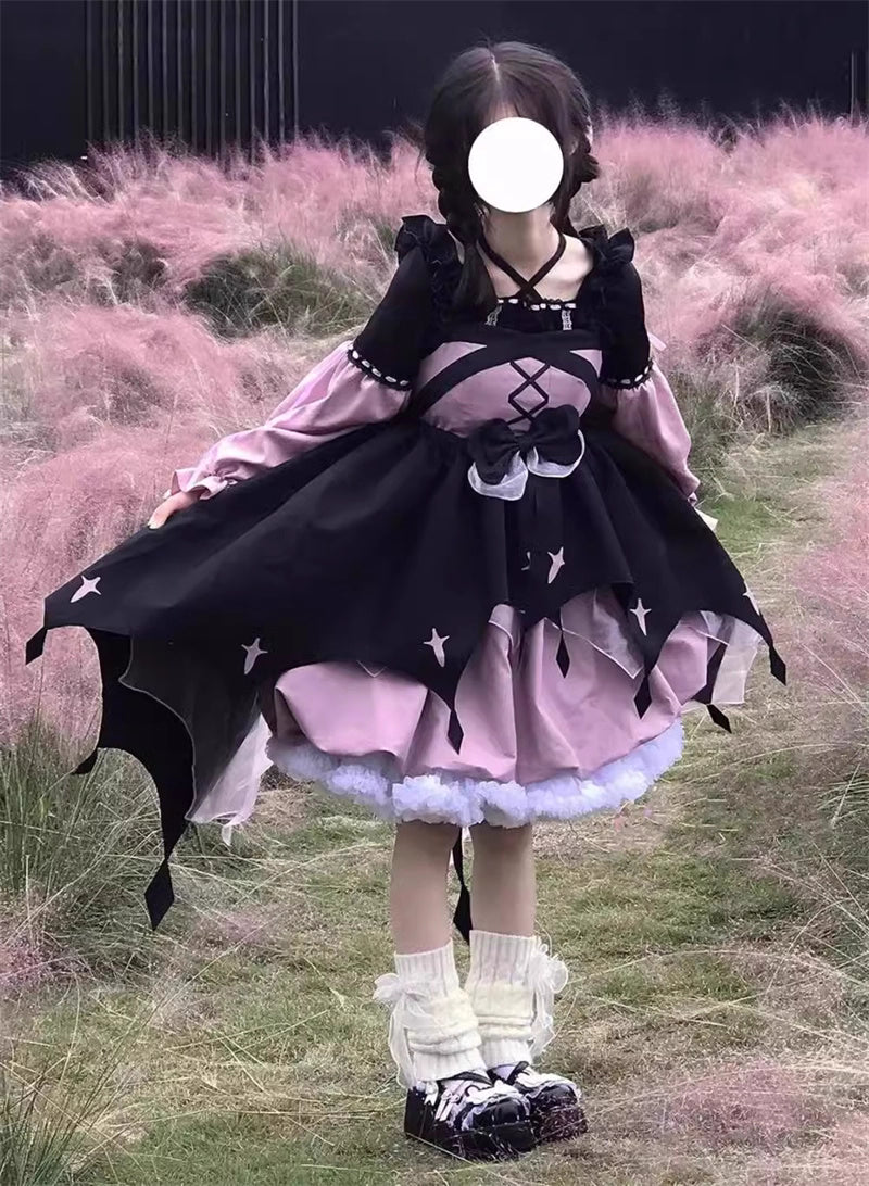 This Black Pink Cute Lolita JSK Dress blends sweet Lolita charm with a playful little witch aesthetic. Designed as a suspender-style JSK, it features a flattering silhouette suitable for autumn and winter wear. The contrasting black and pink tones create a whimsical yet elegant look, while delicate ruffles and bow accents enhance girlish appeal. Perfect for tea parties, cosplay, or seasonal outings, this dress captures the magical essence of Lolita fashion with a charming, mystical twist.