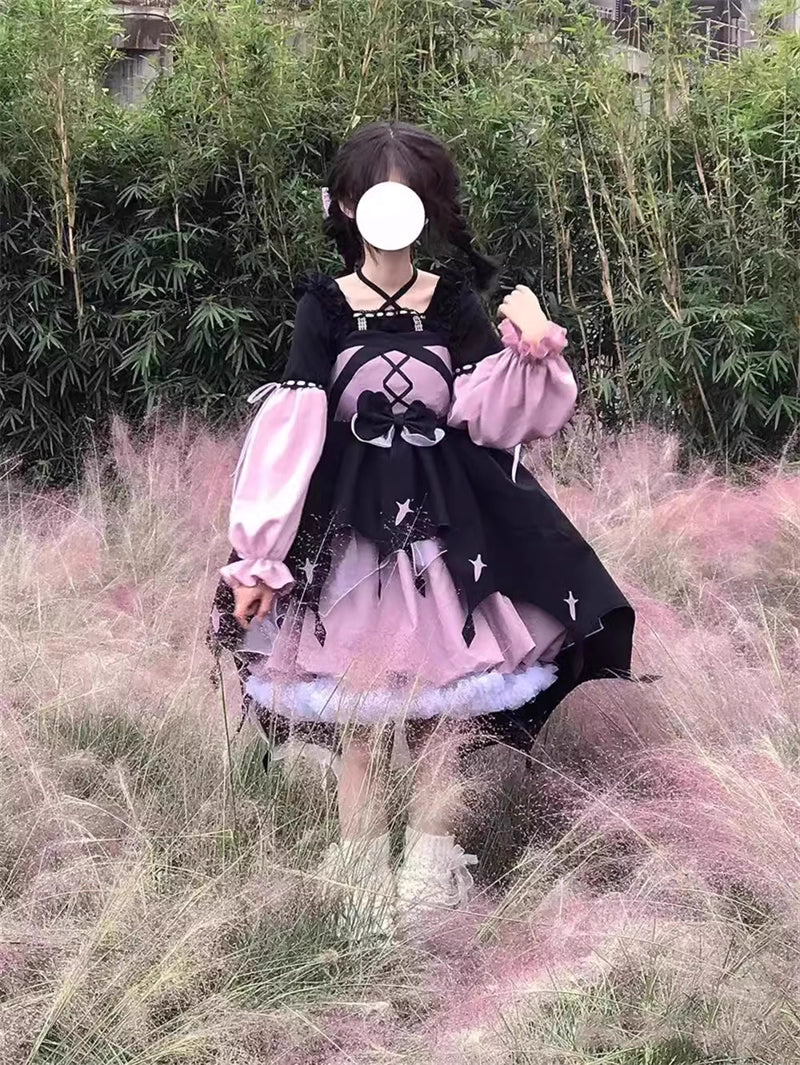 This Black Pink Cute Lolita JSK Dress blends sweet Lolita charm with a playful little witch aesthetic. Designed as a suspender-style JSK, it features a flattering silhouette suitable for autumn and winter wear. The contrasting black and pink tones create a whimsical yet elegant look, while delicate ruffles and bow accents enhance girlish appeal. Perfect for tea parties, cosplay, or seasonal outings, this dress captures the magical essence of Lolita fashion with a charming, mystical twist.