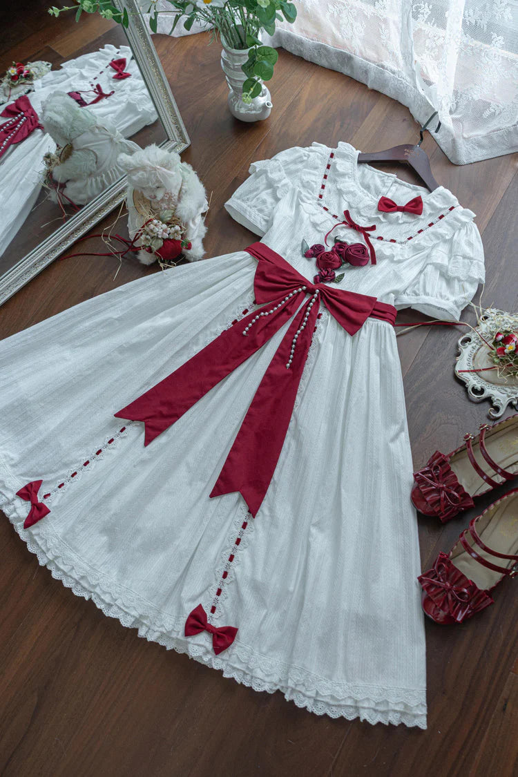 This collection offers two timeless interpretations of Lolita elegance: the profound mystery of classic black and the pristine sweetness of pearl white. Both versions feature the same meticulous design—playful short sleeves, cascading ruffles, and satin bow accents—allowing wearers to choose a hue that reflects their unique style narrative. Whether embodying poetic darkness or luminous innocence, each dress celebrates the harmonious balance between tradition and fantasy.