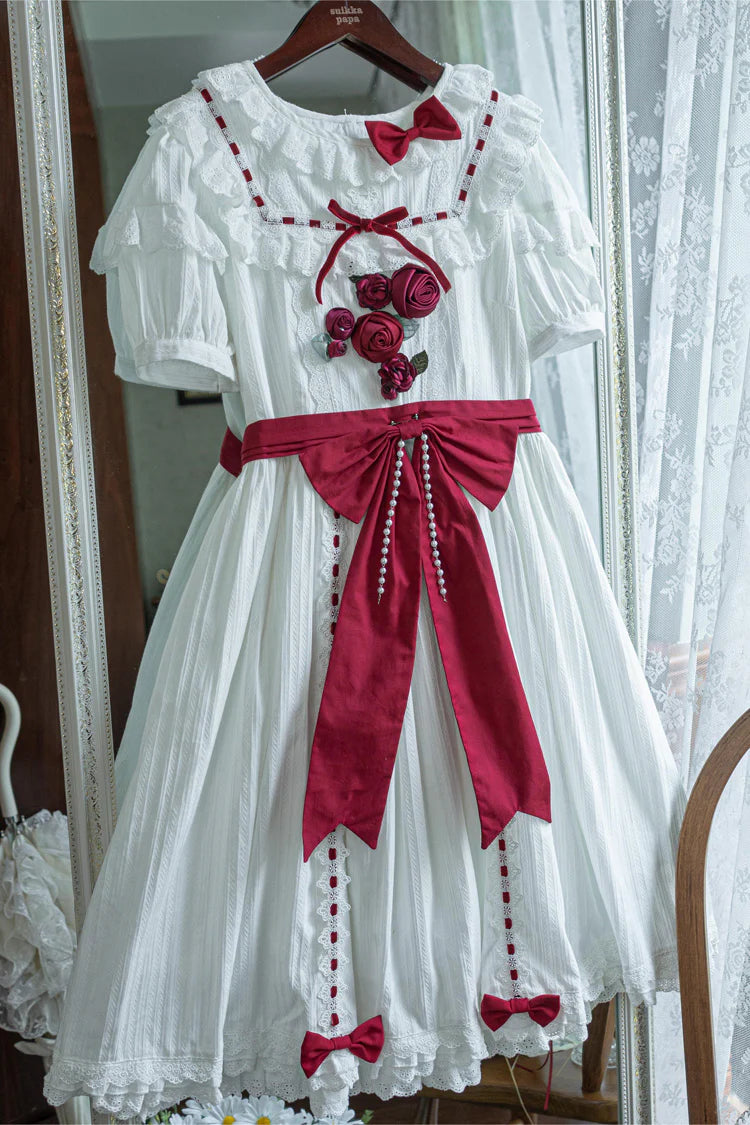 This collection offers two timeless interpretations of Lolita elegance: the profound mystery of classic black and the pristine sweetness of pearl white. Both versions feature the same meticulous design—playful short sleeves, cascading ruffles, and satin bow accents—allowing wearers to choose a hue that reflects their unique style narrative. Whether embodying poetic darkness or luminous innocence, each dress celebrates the harmonious balance between tradition and fantasy.