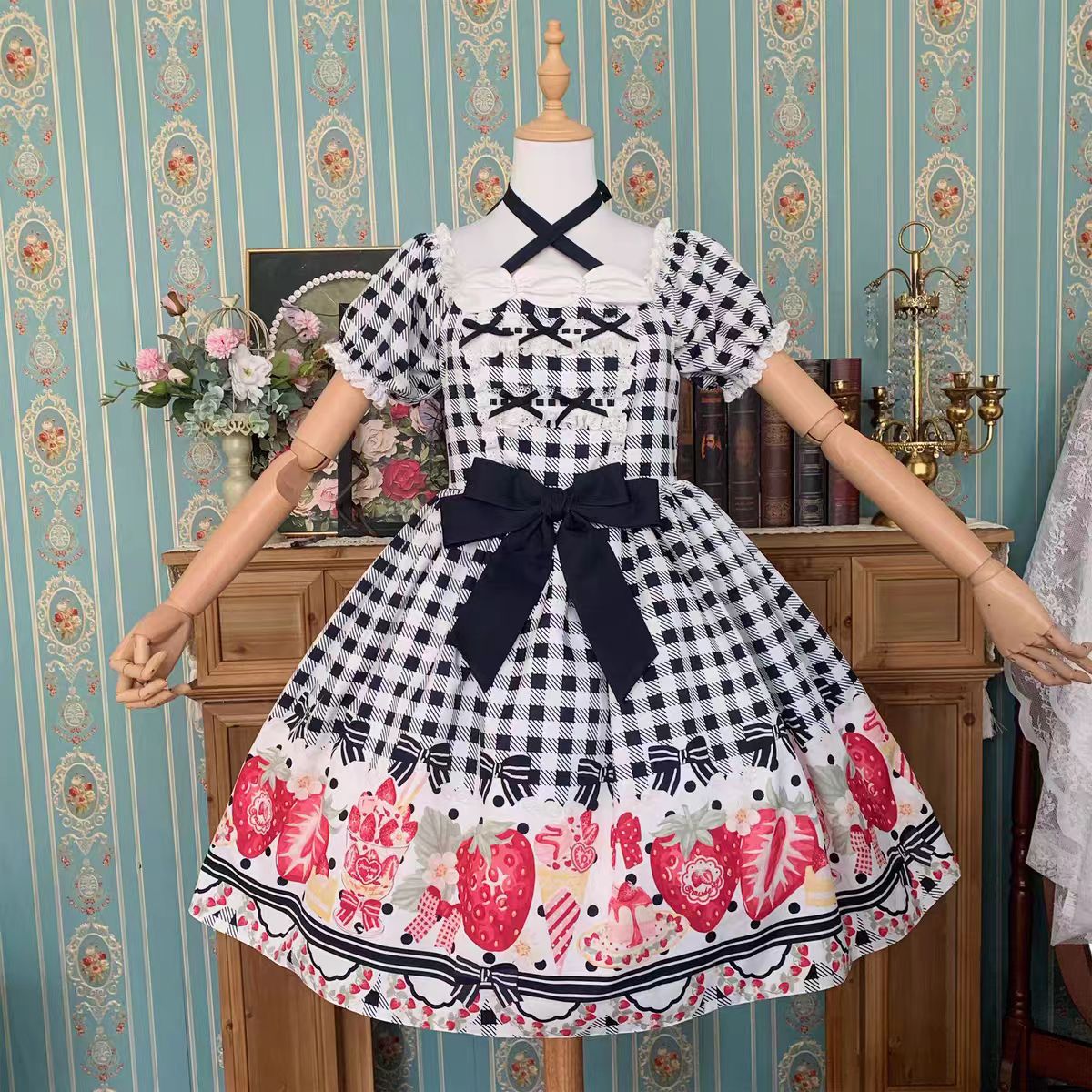 This Cute Black Red Plaid Strawberry Lolita Princess Dress captures the charm of cottage-inspired sweetness. Designed in a plus size friendly cut, it features playful plaid in contrasting black and red tones, adorned with delicate strawberry motifs for a fresh countryside feel. The princess silhouette enhances elegance, while ruffles and bowknot details add girlish charm. Perfect for daily wear, tea parties, or seasonal outings, this dress blends comfort, sweetness, and rustic romance.