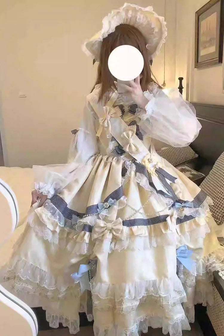 "Inspired by the opulence of royal courts and the delicate beauty of gilded artistry, this dress transforms classic Lolita elegance into a vision of luxury. The gold-toned palette evokes a sense of grandeur, while intricate lace and cascading ruffles reflect both tradition and fantasy."