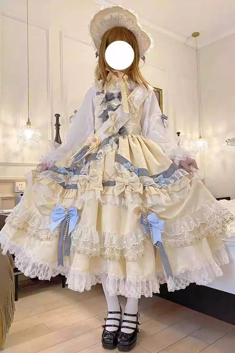 "Inspired by the opulence of royal courts and the delicate beauty of gilded artistry, this dress transforms classic Lolita elegance into a vision of luxury. The gold-toned palette evokes a sense of grandeur, while intricate lace and cascading ruffles reflect both tradition and fantasy."