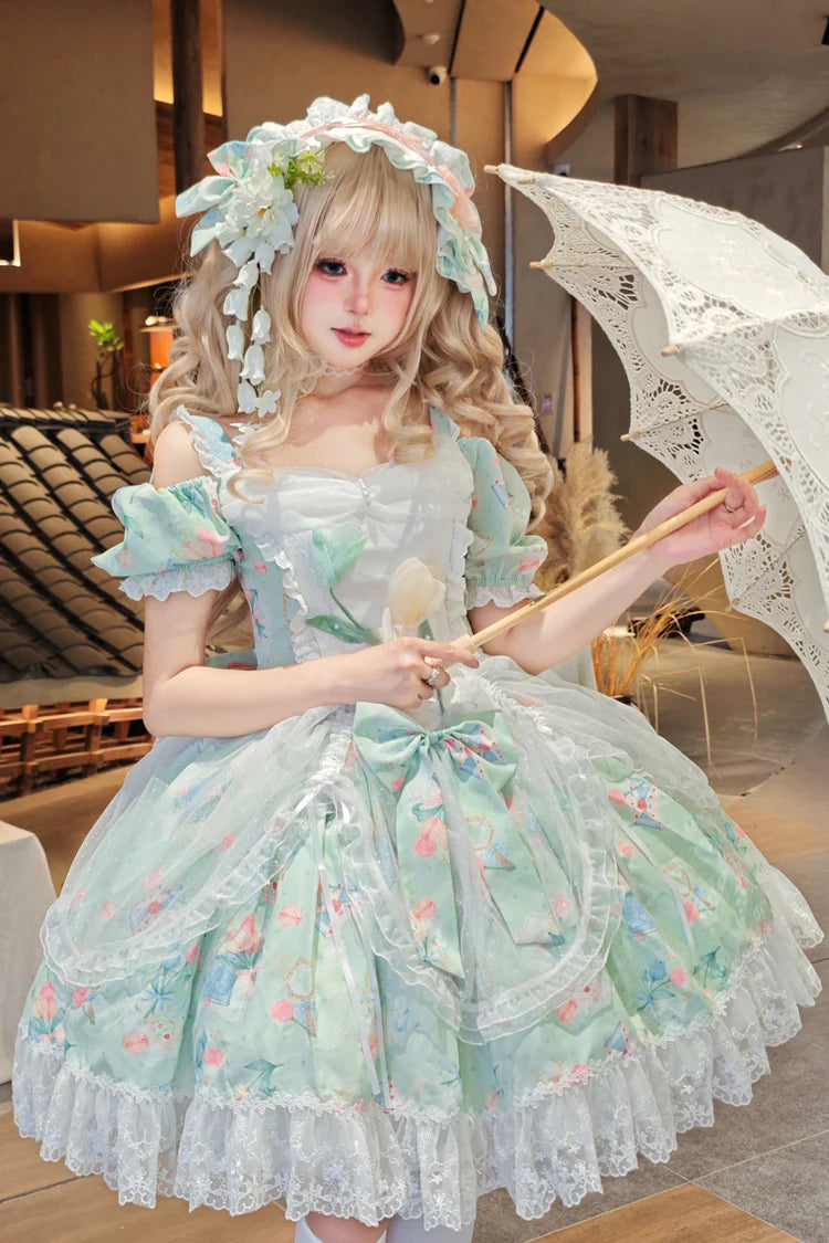 The Green Off-Shoulder Lolita Dress is designed to blend elegance with playful sweetness. Featuring short sleeves and a charming off-shoulder neckline, it highlights femininity with a graceful touch. The printed fabric, layered ruffles, and delicate lace details create a romantic silhouette, while bowknot accents add youthful charm. Perfect for tea parties, gatherings, or seasonal outings, this dress reflects the refined yet whimsical essence of Sweet Lolita fashion in a refreshing green tone.