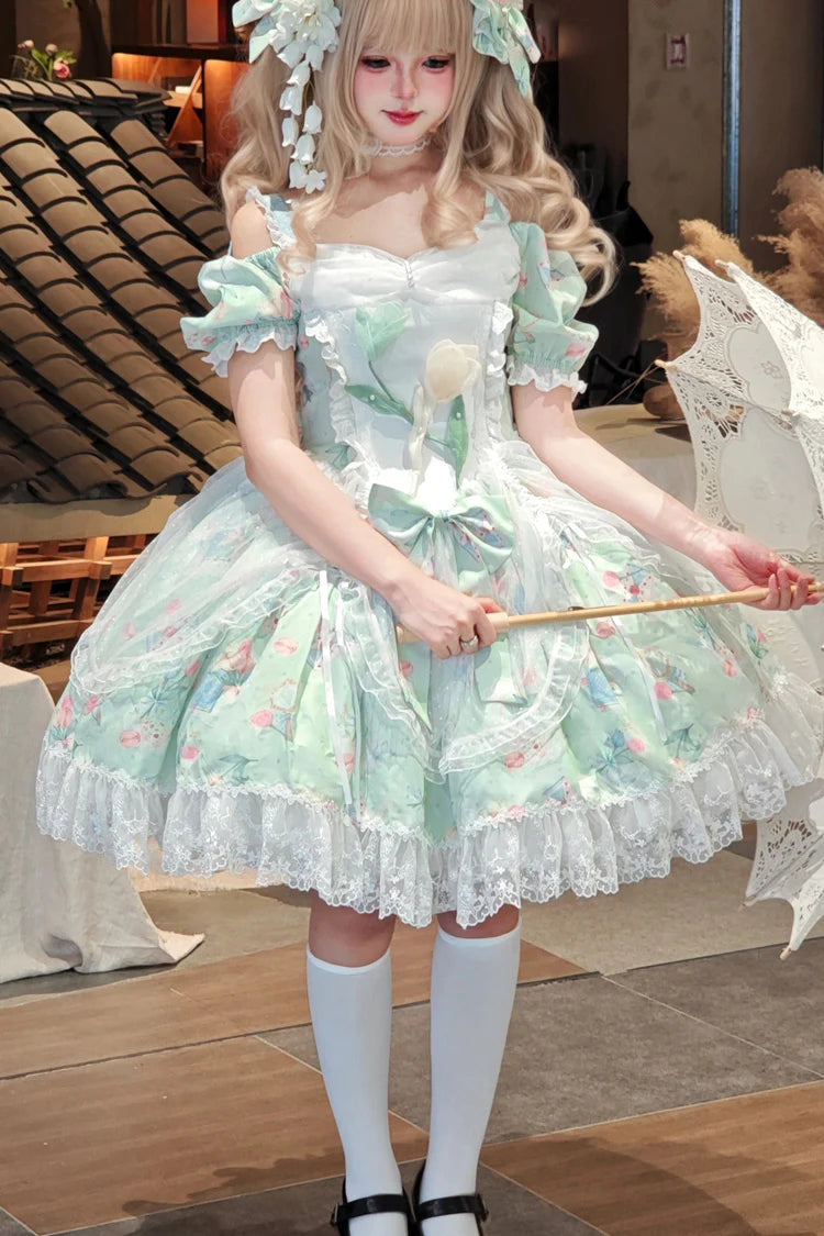 The Green Off-Shoulder Lolita Dress is designed to blend elegance with playful sweetness. Featuring short sleeves and a charming off-shoulder neckline, it highlights femininity with a graceful touch. The printed fabric, layered ruffles, and delicate lace details create a romantic silhouette, while bowknot accents add youthful charm. Perfect for tea parties, gatherings, or seasonal outings, this dress reflects the refined yet whimsical essence of Sweet Lolita fashion in a refreshing green tone.