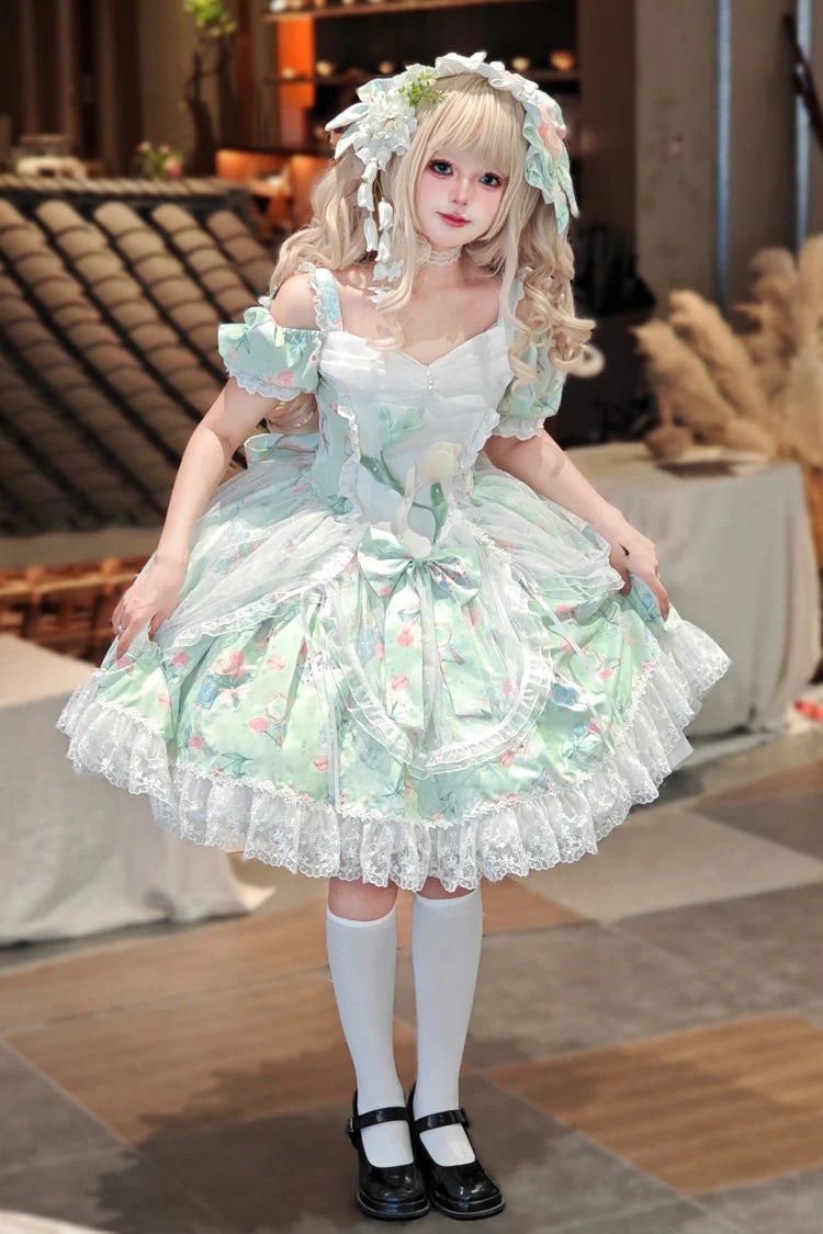 The Green Off-Shoulder Lolita Dress is designed to blend elegance with playful sweetness. Featuring short sleeves and a charming off-shoulder neckline, it highlights femininity with a graceful touch. The printed fabric, layered ruffles, and delicate lace details create a romantic silhouette, while bowknot accents add youthful charm. Perfect for tea parties, gatherings, or seasonal outings, this dress reflects the refined yet whimsical essence of Sweet Lolita fashion in a refreshing green tone.