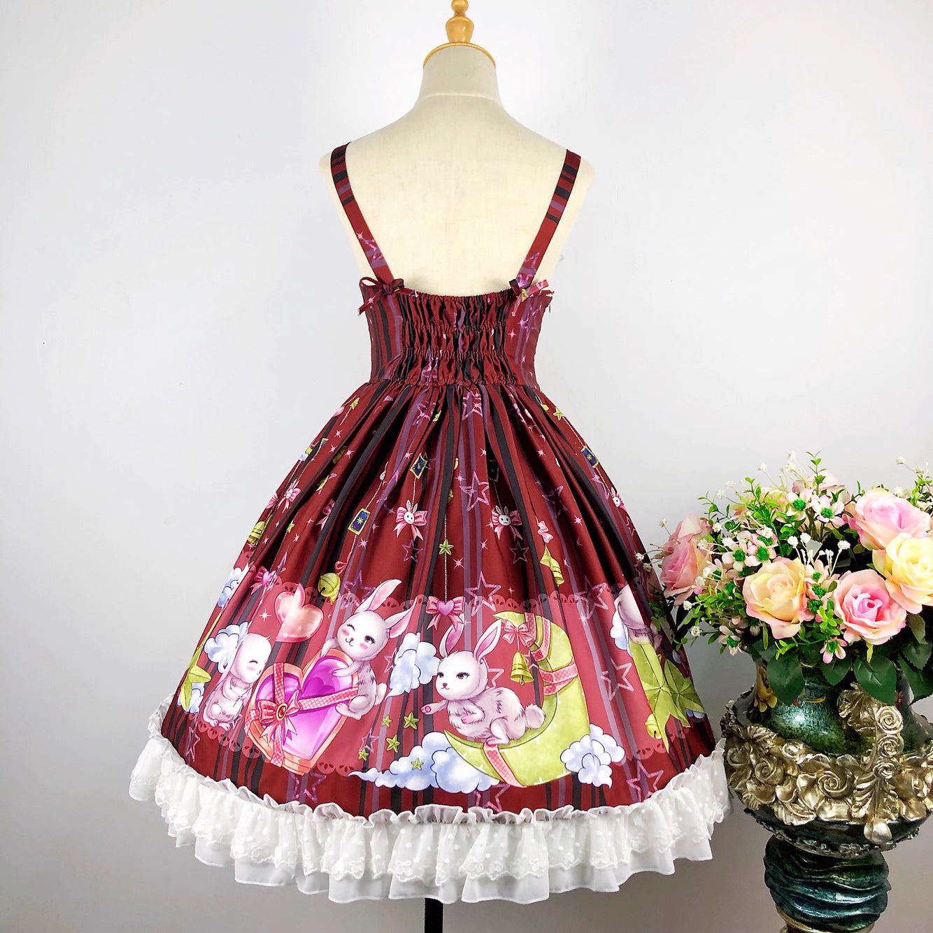 Inspired by a celestial carnival, this "Star Paradise" JSK features vibrant red printed fabric and playful bow accents. The strapless design and A-line silhouette offer a flattering fit for daily wear. Sweet yet versatile, it combines whimsical charm with wearable elegance, perfect for creating joyful coordinates that capture the magic of a starlit fantasy.