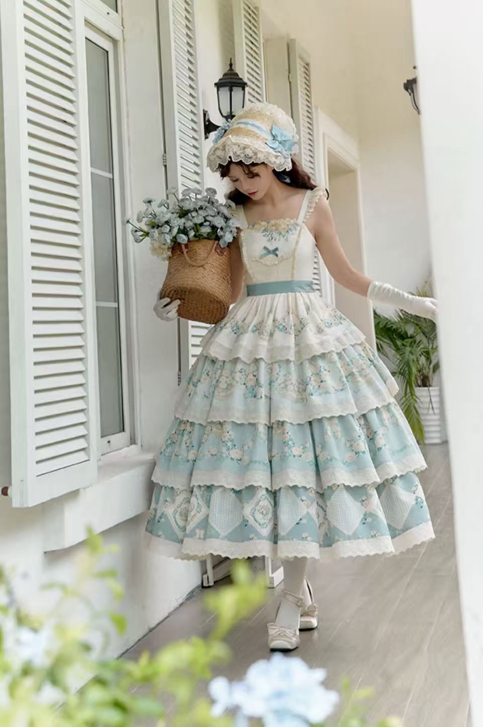 Design Concept: 
This Classic Lolita JSK dress features a pastoral print with delicate embroidery, designed in a tiered silhouette for a graceful layered effect. Available in both red and blue, it brings a charming countryside elegance with a timeless Lolita touch. The set includes the JSK and a matching belt, allowing for a refined fit and added styling versatility.