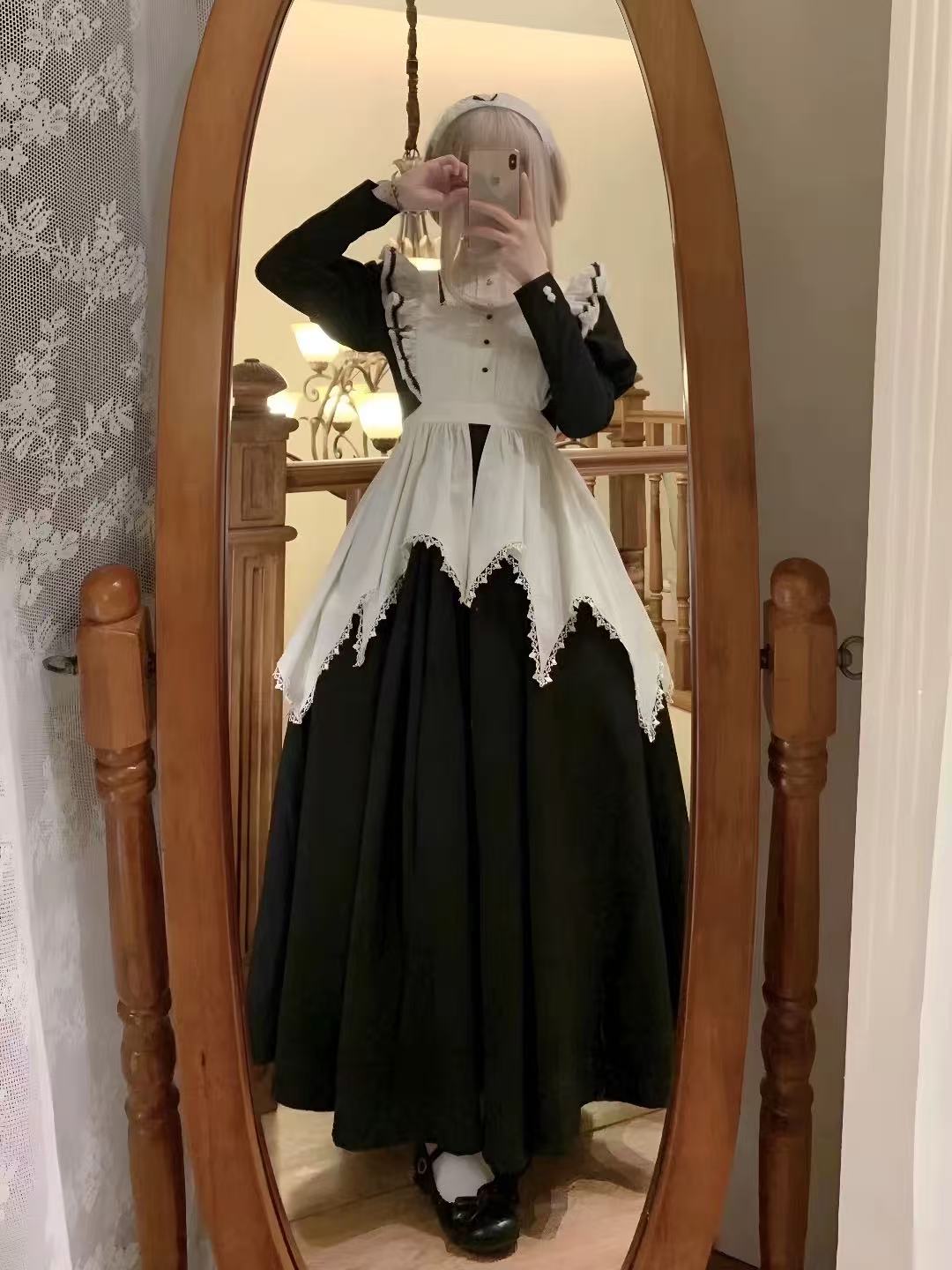 Design Concept:
This Gothic Lolita black nun style maid outfit combines dark elegance with cosplay charm, featuring puff sleeves for a dramatic effect. Product Details: The set includes an apron and a long sleeve dress, creating a complete ensemble perfect for cosplay, themed events, or Halloween occasions.