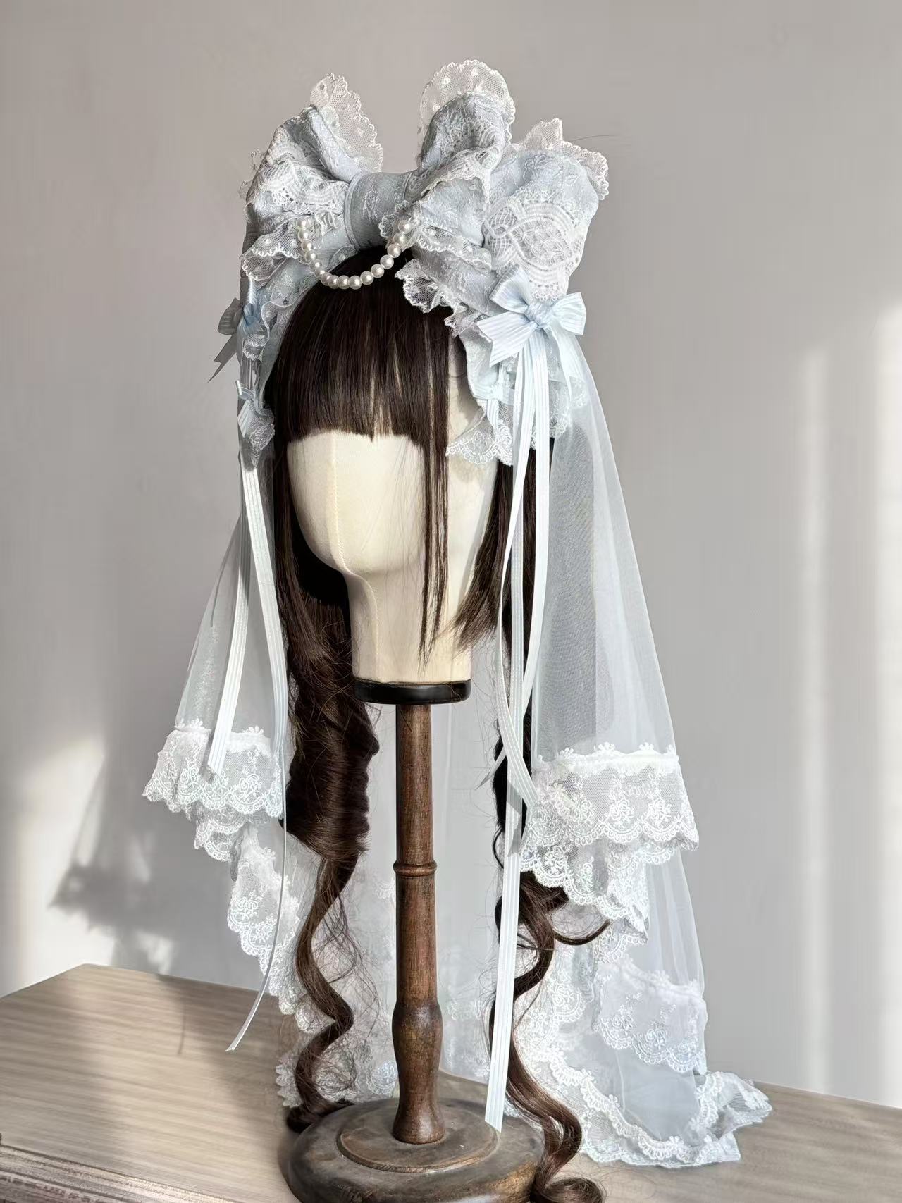 Design Concept:
This Lolita hair accessories set includes a delicate bowknot hair clip (KC) paired with a soft matching veil, creating an elegant and dreamy style. Available in three colors—white, pink, and blue—each design captures a sweet and graceful charm, making it a versatile choice for coordinating with different Lolita outfits.