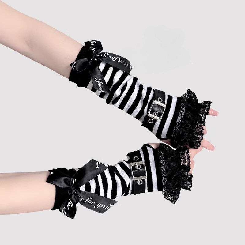 Design Concept:
These Lolita hand accessories feature a striking black and white striped design paired with delicate lace trims, creating the perfect balance of sweet and punk aesthetics. The fingerless style ensures comfort and flexibility, while the decorative buckle detail adds a bold, edgy touch. Crafted from soft cotton with fine lace edging, these sleeves are suitable for layering with both Ouji-inspired coordinates and sweet-punk Lolita outfits.