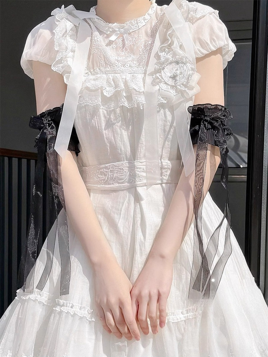 These Lolita hand accessories feature delicate lace with charming bow details, designed in both white and black versions. Perfect for LO-style outfits and cosplay, these arm sleeves add a sweet and elegant touch to your ensemble. Crafted with attention to detail, they are comfortable to wear and versatile for pairing with dresses, blouses, or other Lolita accessories. Each pair enhances the feminine and whimsical aesthetic of your Lolita wardrobe.