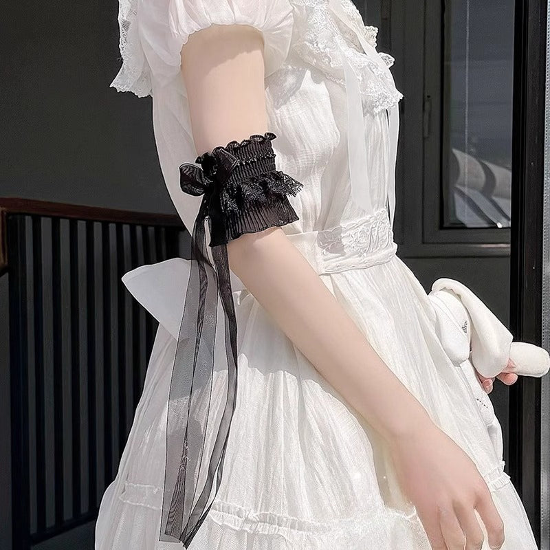 These Lolita hand accessories feature delicate lace with charming bow details, designed in both white and black versions. Perfect for LO-style outfits and cosplay, these arm sleeves add a sweet and elegant touch to your ensemble. Crafted with attention to detail, they are comfortable to wear and versatile for pairing with dresses, blouses, or other Lolita accessories. Each pair enhances the feminine and whimsical aesthetic of your Lolita wardrobe.