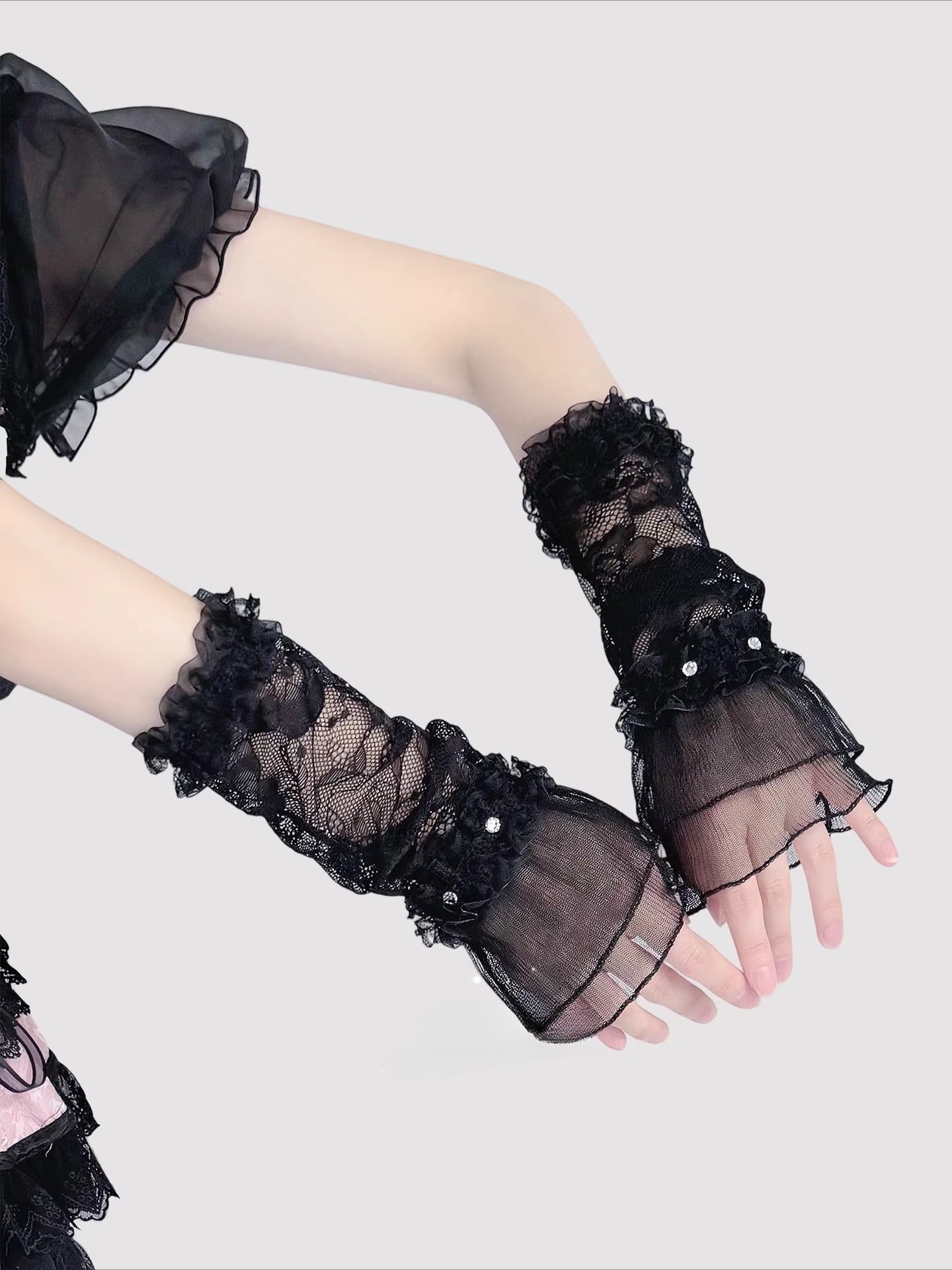Product Description:
These Lolita hand accessories feature delicate lace with sparkling crystal details, designed in both white and black versions. The white style evokes a dreamy bridal elegance, perfect for weddings, fairy cosplay, and pure sweet looks. The black style adds a gothic charm, making it suitable for dark Lolita outfits and dramatic cosplay themes. Each pair comes as two sleeves, crafted with long lace edges that bring out an elegant, refined aesthetic.