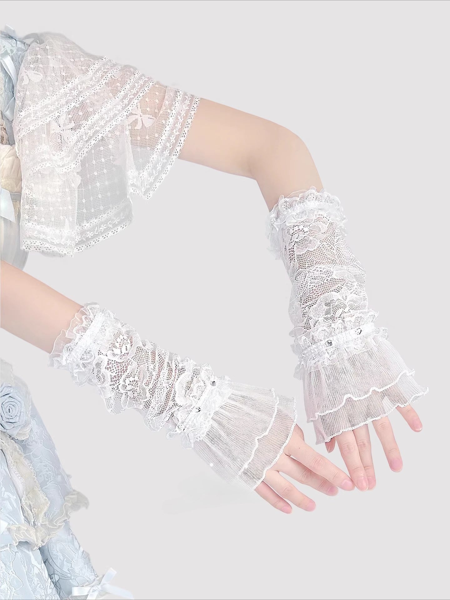 Product Description:
These Lolita hand accessories feature delicate lace with sparkling crystal details, designed in both white and black versions. The white style evokes a dreamy bridal elegance, perfect for weddings, fairy cosplay, and pure sweet looks. The black style adds a gothic charm, making it suitable for dark Lolita outfits and dramatic cosplay themes. Each pair comes as two sleeves, crafted with long lace edges that bring out an elegant, refined aesthetic.
