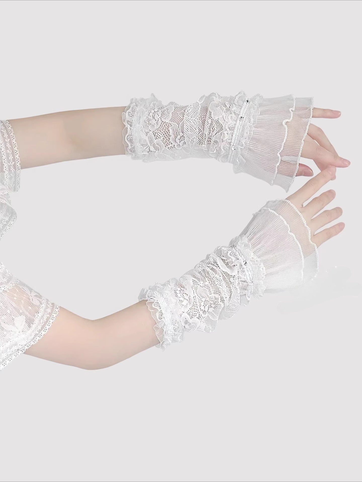 Product Description:
These Lolita hand accessories feature delicate lace with sparkling crystal details, designed in both white and black versions. The white style evokes a dreamy bridal elegance, perfect for weddings, fairy cosplay, and pure sweet looks. The black style adds a gothic charm, making it suitable for dark Lolita outfits and dramatic cosplay themes. Each pair comes as two sleeves, crafted with long lace edges that bring out an elegant, refined aesthetic.
