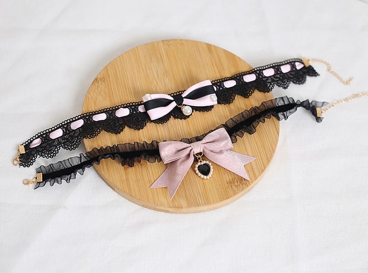 Design Concept:
This Lolita necklace collection comes in two charming variations. The dark pink version features a delicate lace choker adorned with a black heart pendant, while the light pink version is styled with a graceful pearl pendant. Both designs are accented with bow details, creating a sweet and elegant Lolita accessory perfect for completing a lovely outfit.