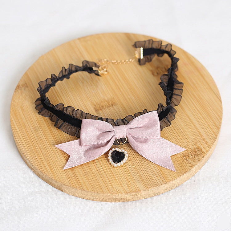 Design Concept:
This Lolita necklace collection comes in two charming variations. The dark pink version features a delicate lace choker adorned with a black heart pendant, while the light pink version is styled with a graceful pearl pendant. Both designs are accented with bow details, creating a sweet and elegant Lolita accessory perfect for completing a lovely outfit.