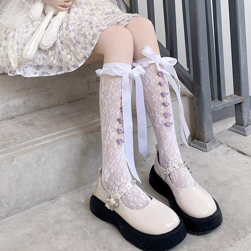 Design Concept:
These Lolita stockings are designed with delicate lace flowers and charming bow ribbon ties, available in black and white. The mid-calf length creates a sweet and elegant silhouette, perfect for pairing with Lolita dresses and skirts. Crafted with soft fabric and detailed lace edging, they bring out a cute Japanese-inspired Lolita aesthetic, making them ideal for both daily wear and cosplay styling.