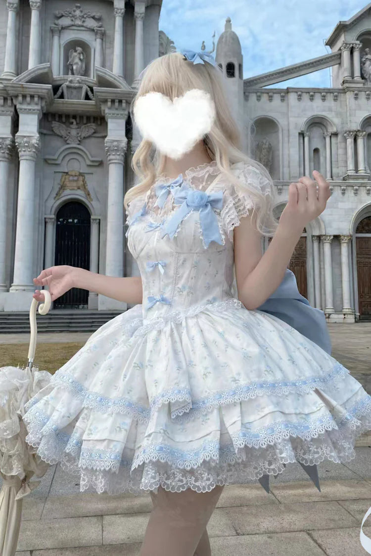 Design Concept: 
Immerse yourself in a fairy tale with this complete Sweet Lolita coord set. The set features a beautiful blue colorway with an all-over delicate floral print, perfect for creating a sweet and romantic look. The centerpiece is a Jumperskirt (JSK) dress, adorned with multi-layered ruffles, intricate lace, and a charming bow detail. The matching blouse complements the dress perfectly, creating a harmonious and fully styled silhouette.