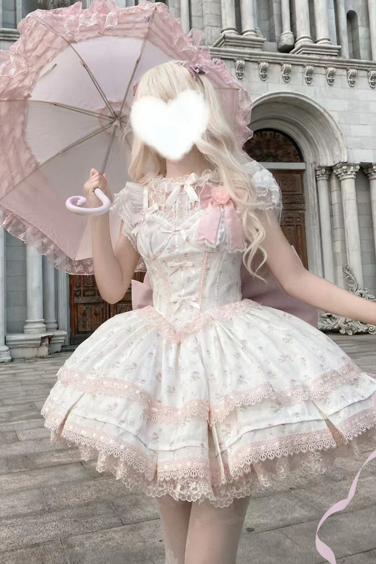 Design Concept: 
This Sweet Lolita pink layered printed JSK dress set combines playful charm with delicate elegance, featuring soft ruffles, intricate lace, and bow details for a delightful Lolita style. The pastel pink tone enhances its sweet and romantic appeal. The product includes a dress, a matching blouse, and a trailing tail, creating a complete and enchanting ensemble.
