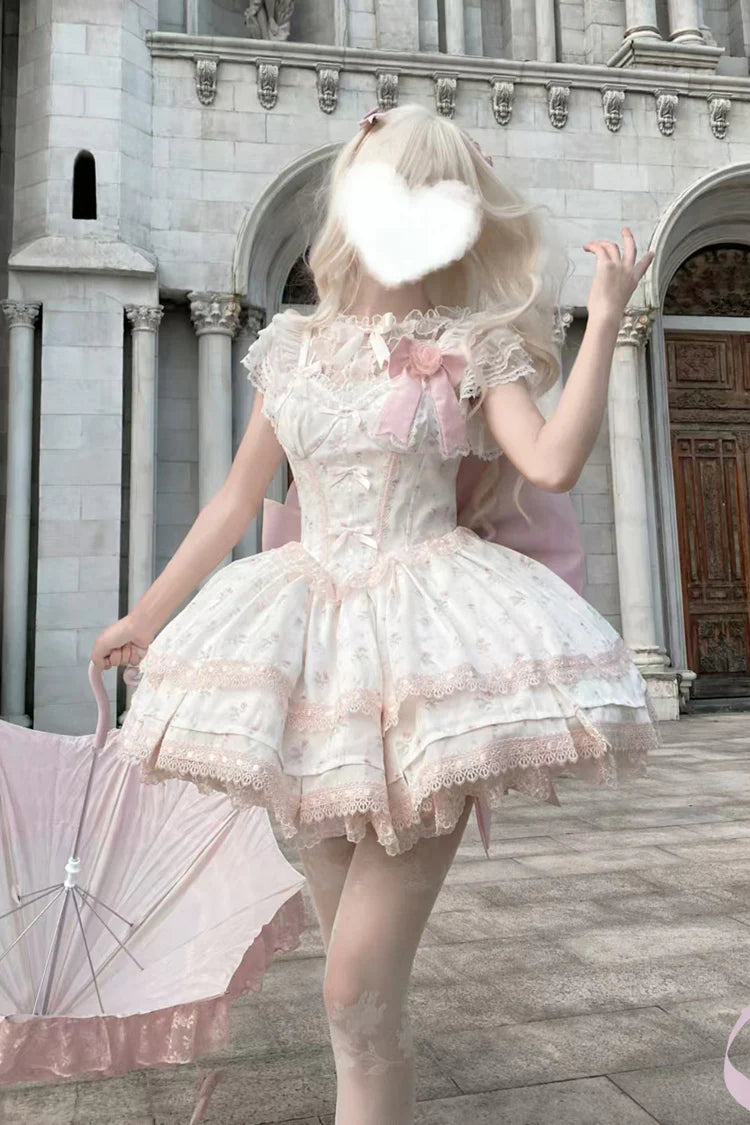 Design Concept: 
This Sweet Lolita pink layered printed JSK dress set combines playful charm with delicate elegance, featuring soft ruffles, intricate lace, and bow details for a delightful Lolita style. The pastel pink tone enhances its sweet and romantic appeal. The product includes a dress, a matching blouse, and a trailing tail, creating a complete and enchanting ensemble.