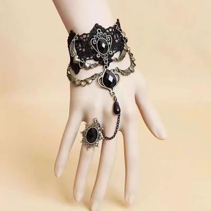 The Black Retro Fashion Gemstone Butterfly Gothic Lolita Ring Bracelet is designed to embody elegance with a dark romantic twist. Inspired by vintage aesthetics, it features a delicate butterfly motif paired with shimmering gemstones that create a mysterious, enchanting aura. The connected ring and bracelet design adds uniqueness and drama, making it an ideal accessory for Gothic Lolita outfits. Both stylish and expressive, it highlights individuality while enhancing the charm of any retro or Lolita-inspire