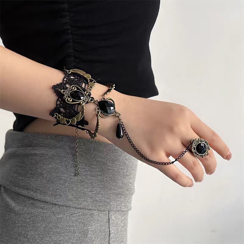 The Black Retro Fashion Gemstone Butterfly Gothic Lolita Ring Bracelet is designed to embody elegance with a dark romantic twist. Inspired by vintage aesthetics, it features a delicate butterfly motif paired with shimmering gemstones that create a mysterious, enchanting aura. The connected ring and bracelet design adds uniqueness and drama, making it an ideal accessory for Gothic Lolita outfits. Both stylish and expressive, it highlights individuality while enhancing the charm of any retro or Lolita-inspire