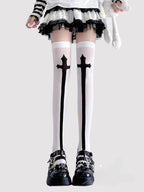 Inspired by the rebellious fusion of gothic punk and JK fashion, these thigh-high socks blend dark elegance with subcultural edge. The stark black-and-white contrast and symbolic cross motifs evoke a provocative yet sophisticated vibe. Perfect for Halloween events, cosplay, or streetwear statements, they embody a fearless expression of alternative style with a touch of daring allure.