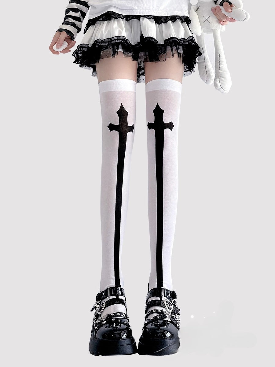 Inspired by the rebellious fusion of gothic punk and JK fashion, these thigh-high socks blend dark elegance with subcultural edge. The stark black-and-white contrast and symbolic cross motifs evoke a provocative yet sophisticated vibe. Perfect for Halloween events, cosplay, or streetwear statements, they embody a fearless expression of alternative style with a touch of daring allure.
