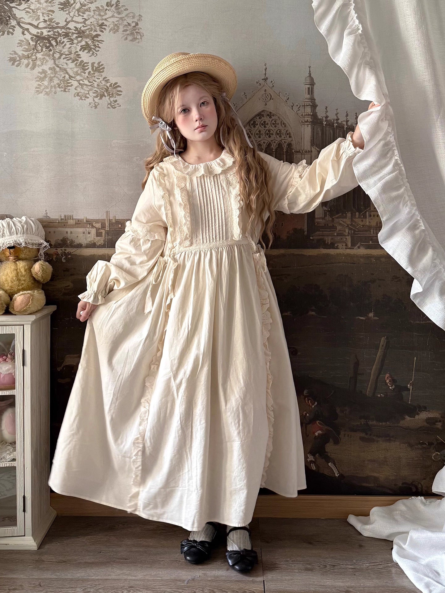 Inspired by romantic French countryside aesthetics, this dress combines delicate embroidery with soft tiered ruffles and voluminous bubble sleeves. The loose high-waist silhouette flows gracefully in lightweight fabric, while intricate floral motifs and a warm beige palette evoke nostalgic elegance. Perfect for autumn gatherings, it blends vintage charm with effortless comfort—a poetic homage to pastoral beauty and timeless femininity.