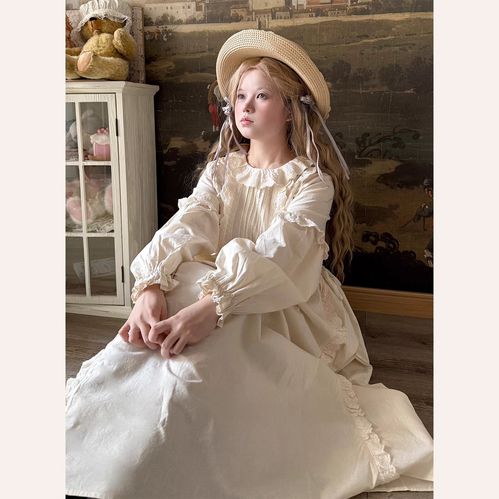 Inspired by romantic French countryside aesthetics, this dress combines delicate embroidery with soft tiered ruffles and voluminous bubble sleeves. The loose high-waist silhouette flows gracefully in lightweight fabric, while intricate floral motifs and a warm beige palette evoke nostalgic elegance. Perfect for autumn gatherings, it blends vintage charm with effortless comfort—a poetic homage to pastoral beauty and timeless femininity.