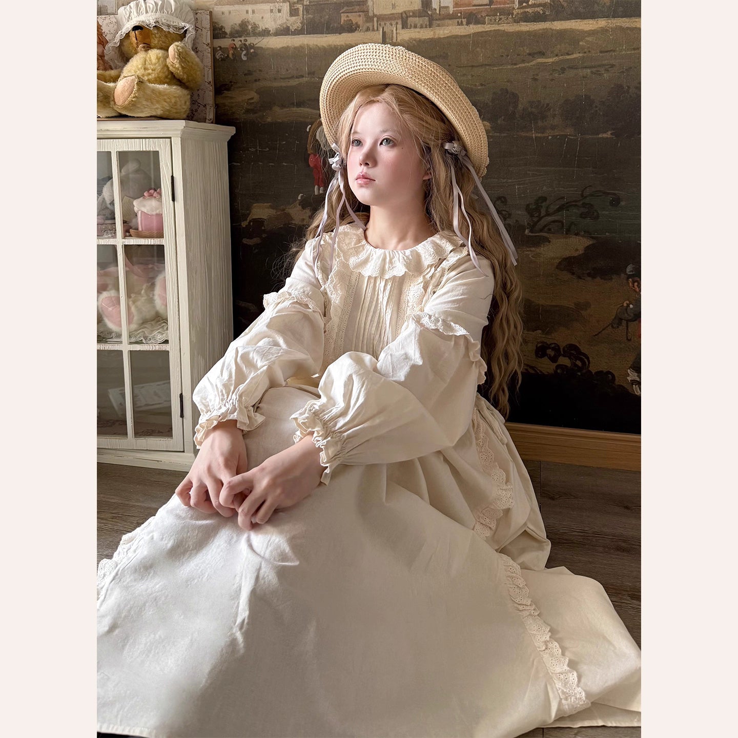 Inspired by romantic French countryside aesthetics, this dress combines delicate embroidery with soft tiered ruffles and voluminous bubble sleeves. The loose high-waist silhouette flows gracefully in lightweight fabric, while intricate floral motifs and a warm beige palette evoke nostalgic elegance. Perfect for autumn gatherings, it blends vintage charm with effortless comfort—a poetic homage to pastoral beauty and timeless femininity.