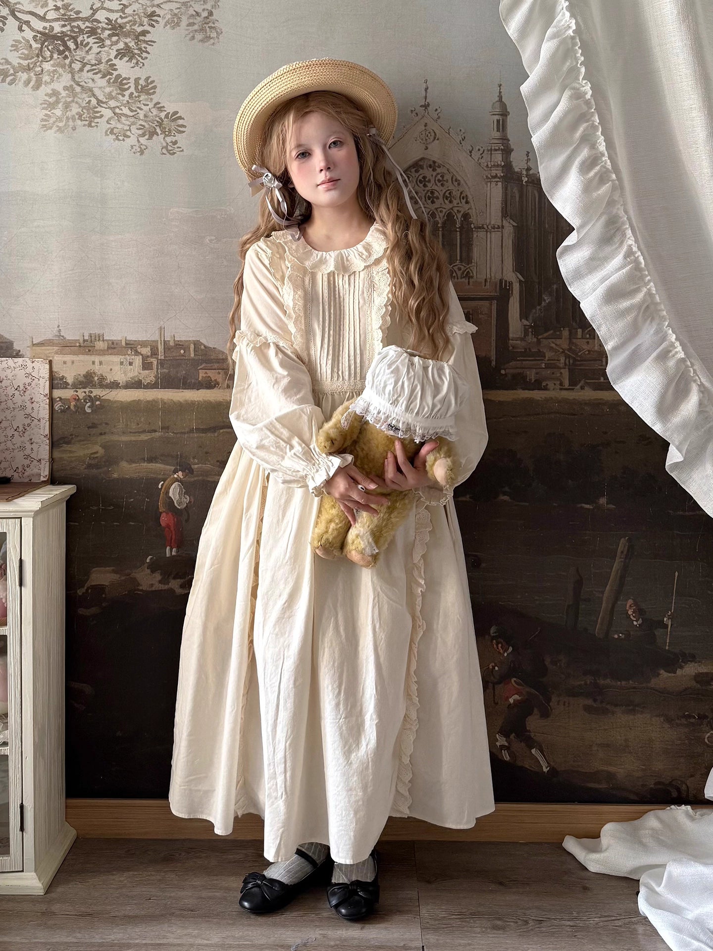 Inspired by romantic French countryside aesthetics, this dress combines delicate embroidery with soft tiered ruffles and voluminous bubble sleeves. The loose high-waist silhouette flows gracefully in lightweight fabric, while intricate floral motifs and a warm beige palette evoke nostalgic elegance. Perfect for autumn gatherings, it blends vintage charm with effortless comfort—a poetic homage to pastoral beauty and timeless femininity.