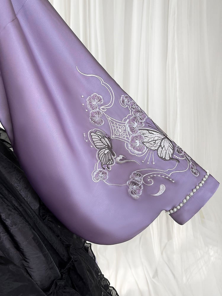 The Classic Purple Han Lolita Dress Set is designed to blend traditional elegance with Lolita sweetness. Featuring delicate butterfly and floral embroidery, it showcases refined craftsmanship and a graceful silhouette. The rich purple tone conveys nobility and charm, while the contrasting black apron adds depth and vintage flair. Perfect for cultural events, tea parties, or special gatherings, this full set reflects the harmonious fusion of Han-inspired beauty and Lolita fashion.