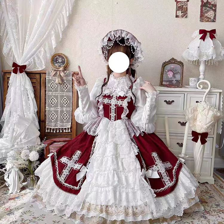 This Red Classic Vintage Doll Lolita JSK Dress is inspired by the elegance of bridal fashion and the sweetness of doll-like charm. The deep red tone conveys romance and nobility, while the structured JSK silhouette highlights a graceful figure. Delicate lace and vintage details add refinement, making it perfect for tea parties, weddings, or special occasions. Designed to blend timeless elegance with Lolita’s dreamy aesthetic, this dress captures both beauty and sophistication.