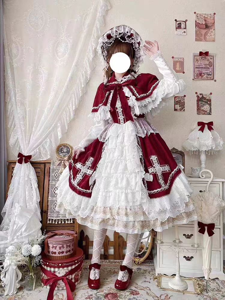 This Red Classic Vintage Doll Lolita JSK Dress is inspired by the elegance of bridal fashion and the sweetness of doll-like charm. The deep red tone conveys romance and nobility, while the structured JSK silhouette highlights a graceful figure. Delicate lace and vintage details add refinement, making it perfect for tea parties, weddings, or special occasions. Designed to blend timeless elegance with Lolita’s dreamy aesthetic, this dress captures both beauty and sophistication.