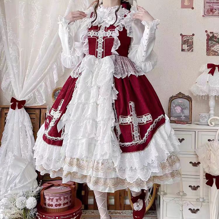 This Red Classic Vintage Doll Lolita JSK Dress is inspired by the elegance of bridal fashion and the sweetness of doll-like charm. The deep red tone conveys romance and nobility, while the structured JSK silhouette highlights a graceful figure. Delicate lace and vintage details add refinement, making it perfect for tea parties, weddings, or special occasions. Designed to blend timeless elegance with Lolita’s dreamy aesthetic, this dress captures both beauty and sophistication.