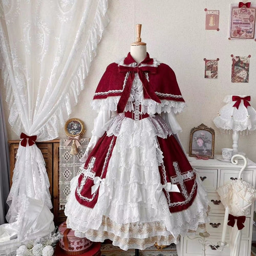 This Red Classic Vintage Doll Lolita JSK Dress is inspired by the elegance of bridal fashion and the sweetness of doll-like charm. The deep red tone conveys romance and nobility, while the structured JSK silhouette highlights a graceful figure. Delicate lace and vintage details add refinement, making it perfect for tea parties, weddings, or special occasions. Designed to blend timeless elegance with Lolita’s dreamy aesthetic, this dress captures both beauty and sophistication.