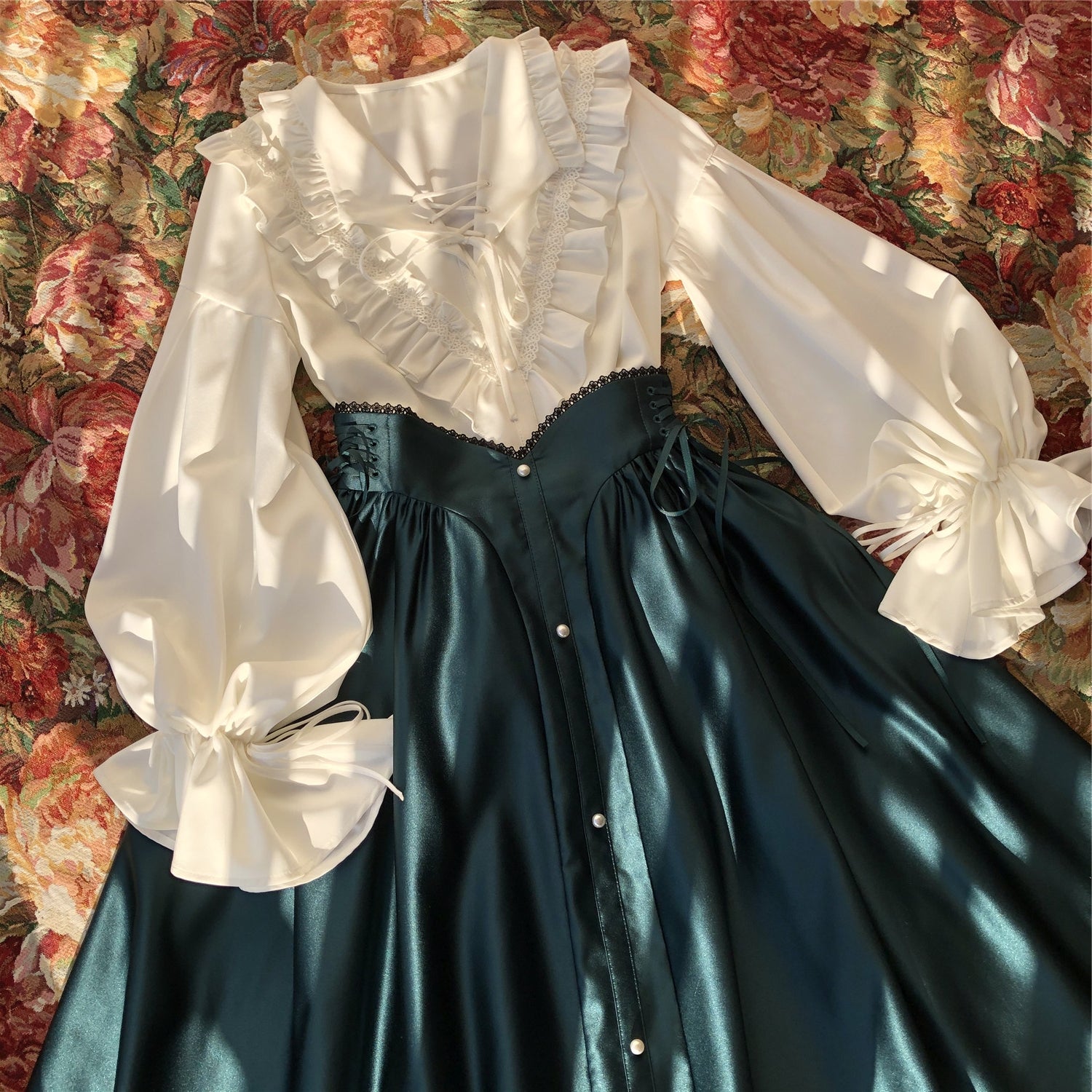 Embrace timeless elegance with our Elegant Melody set, blending Gothic charm with light Lolita grace. This coordinated ensemble features a delicate blouse and an A-line skirt designed to create a flattering silhouette. Intricate lace details and vintage-inspired accents evoke a sense of poetic romance, while the dark color palette adds depth and sophistication. Perfect for tea parties or evening gatherings, this set offers a harmonious balance between classic refinement and wearable comfort. Pre-order now t