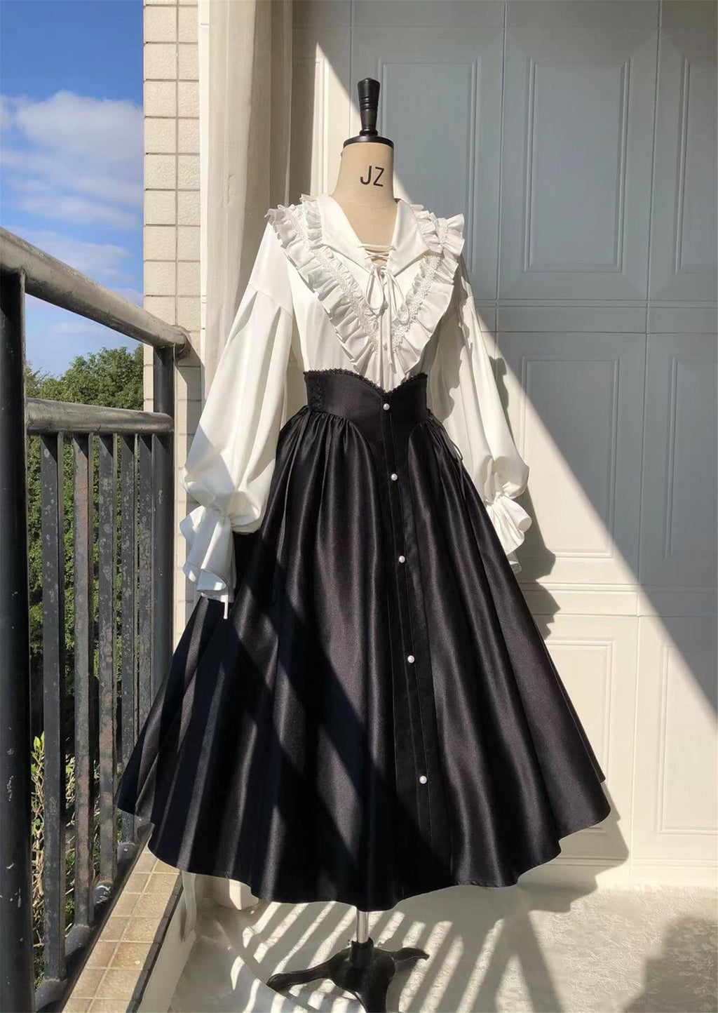 Embrace timeless elegance with our Elegant Melody set, blending Gothic charm with light Lolita grace. This coordinated ensemble features a delicate blouse and an A-line skirt designed to create a flattering silhouette. Intricate lace details and vintage-inspired accents evoke a sense of poetic romance, while the dark color palette adds depth and sophistication. Perfect for tea parties or evening gatherings, this set offers a harmonious balance between classic refinement and wearable comfort. Pre-order now t