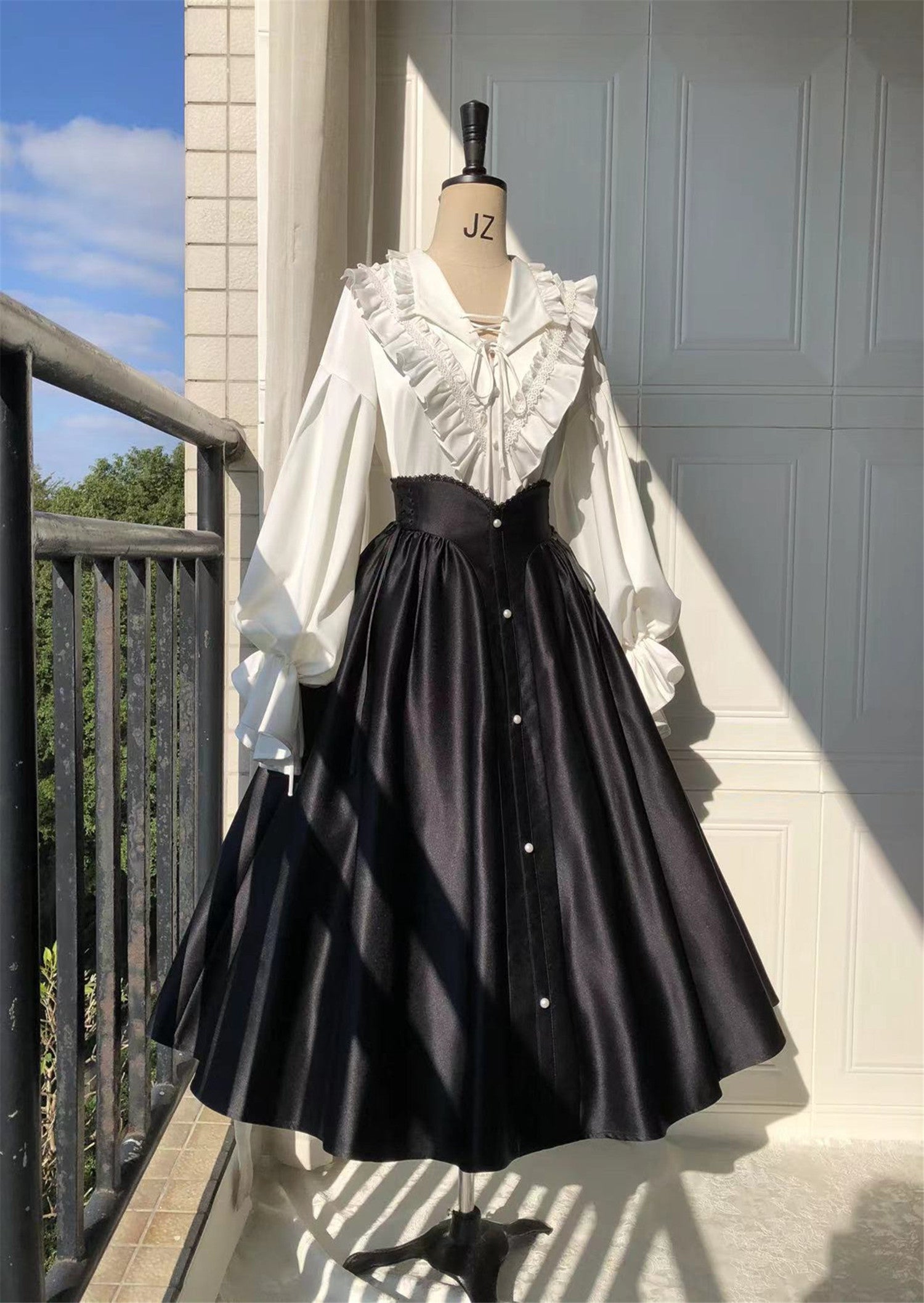 Embrace timeless elegance with our Elegant Melody set, blending Gothic charm with light Lolita grace. This coordinated ensemble features a delicate blouse and an A-line skirt designed to create a flattering silhouette. Intricate lace details and vintage-inspired accents evoke a sense of poetic romance, while the dark color palette adds depth and sophistication. Perfect for tea parties or evening gatherings, this set offers a harmonious balance between classic refinement and wearable comfort. Pre-order now t