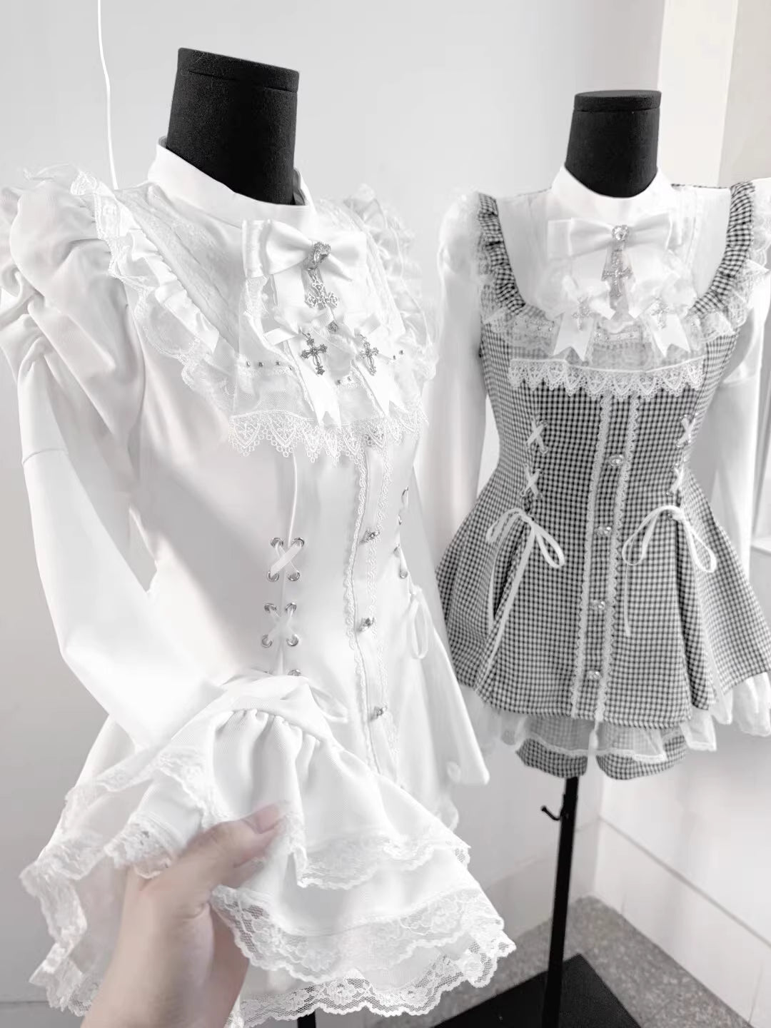 This bell-sleeve Gothic Lolita dress combines dark elegance with petite-friendly proportions. Rendered in stark black and white, its A-line silhouette and delicate lace details create a whimsical yet edgy aesthetic. The dramatic sleeves and tailored waist flatter smaller frames, making it ideal for coordinations blending Japanese-inspired sweetness with timeless Gothic romance.