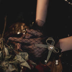 These gothic Lolita lace gloves are crafted with delicate sheer mesh and floral lace trim, blending elegance with sensual charm. The black design adds a mysterious gothic touch, while the thin fabric creates a graceful silhouette. Perfect for weddings, qipao styling, Halloween cosplay, or themed photo shoots, these gloves complete any Lolita or bridal-inspired outfit with timeless allure.