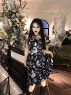 Embrace dark romance in this striking Gothic mini dress, where underground subculture meets high fashion. The bold skeleton and rose hand-print design creates a haunting visual narrative against the fitted silhouette. Designed with a built-in corset bustier for waist-cinching definition, this dress accentuates your curves while making a powerful street-style statement. Lightweight yet dramatic, it transitions seamlessly from concert venues to night markets. The adjustable straps and breathable fabric ensure