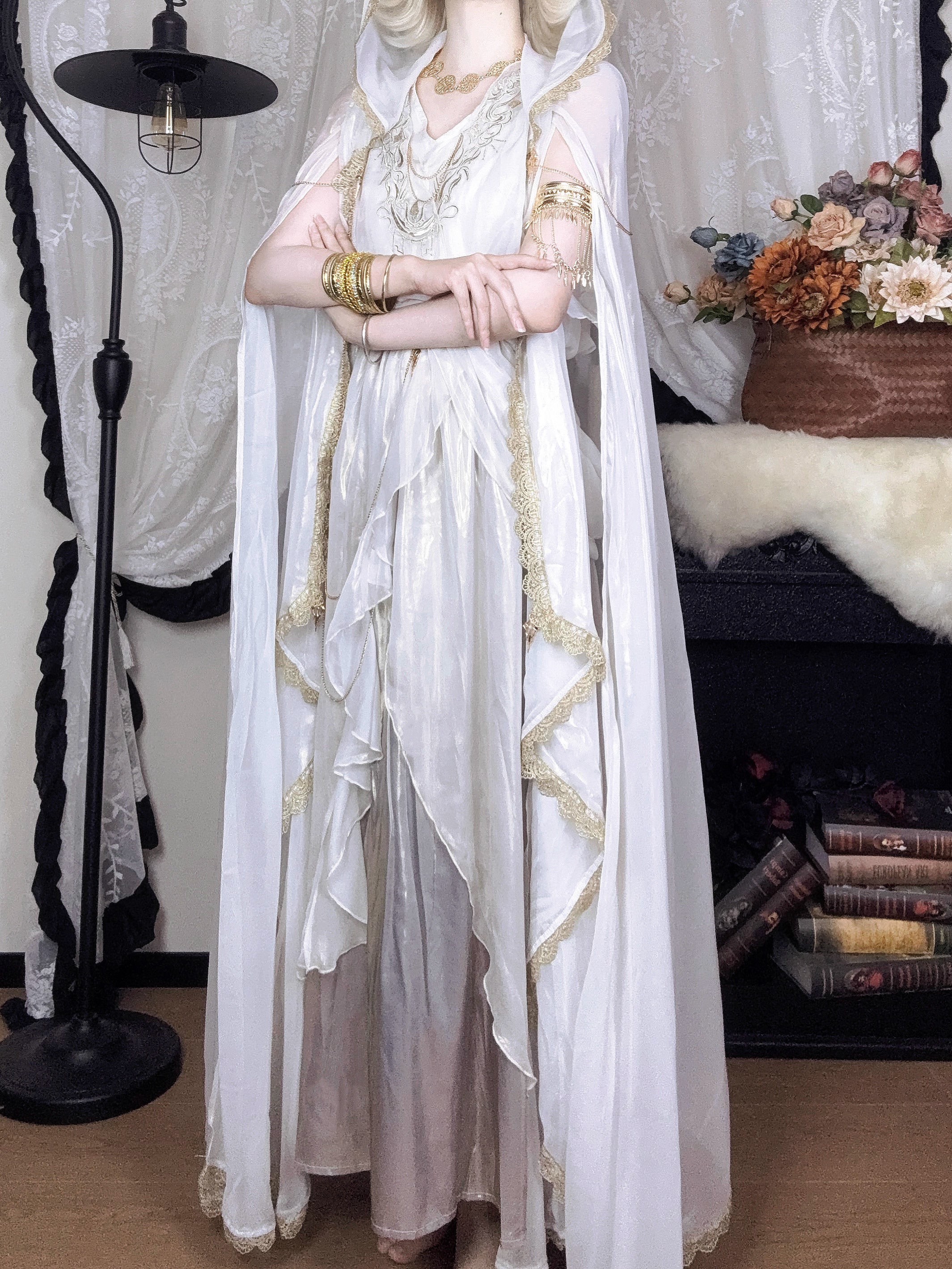 This White Angelic Greek Goddess Lolita Dress Set is designed to capture divine elegance and ethereal charm. The flowing cape adds a goddess-like aura, while the soft white palette enhances purity and grace. Inspired by Greek mythology and angelic beauty, the silhouette blends classic Lolita sweetness with majestic refinement. Perfect for special occasions, photoshoots, or themed gatherings, this set conveys a timeless elegance that feels both celestial and romantic.